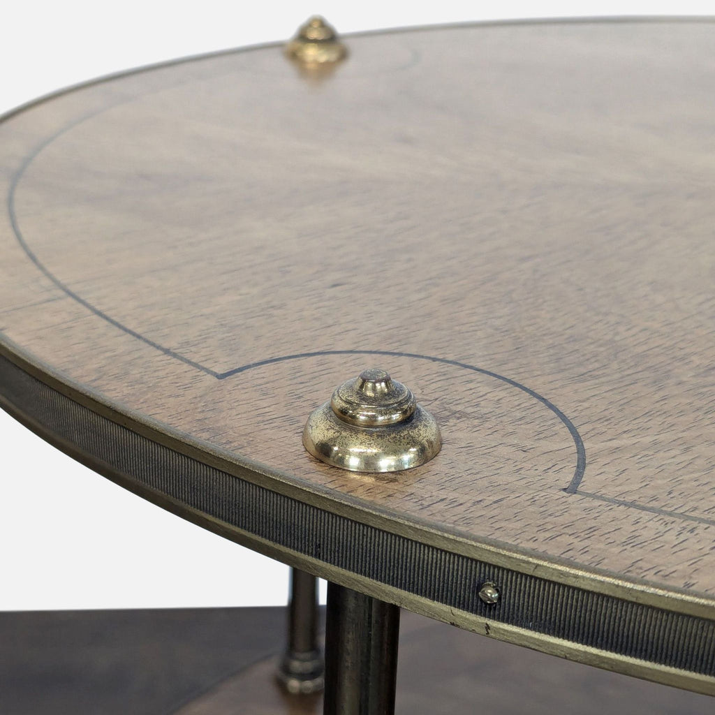 Elegant end table from Old Colony Furniture, detailed with inlay design and supported by brass legs.