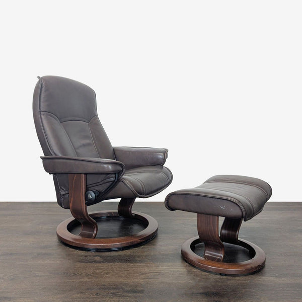 Dark brown leather Stressless lounge chair and ottoman with wood base, offering ergonomic comfort and modern style.