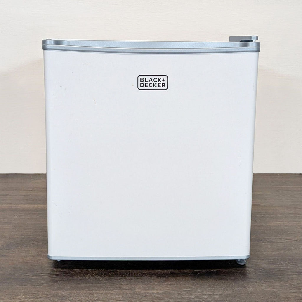 Compact white Black + Decker mini fridge with a sleek, modern design ideal for offices or dorms.  