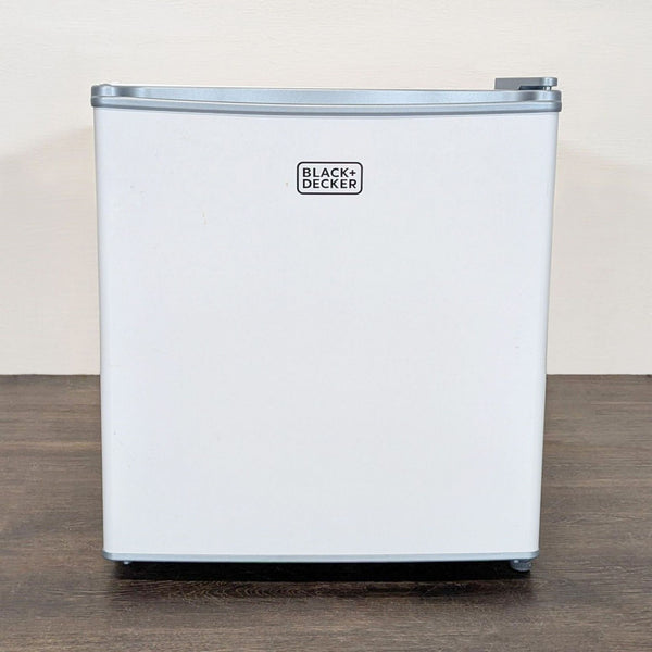 Compact white Black + Decker mini fridge with a sleek, modern design ideal for offices or dorms.  