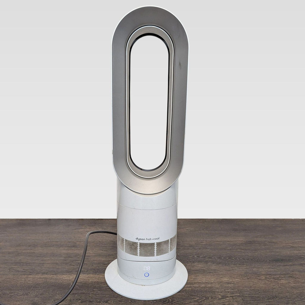 Dyson AM05 fan heater with modern bladeless style, compact control panel, fits AC & Fans category.