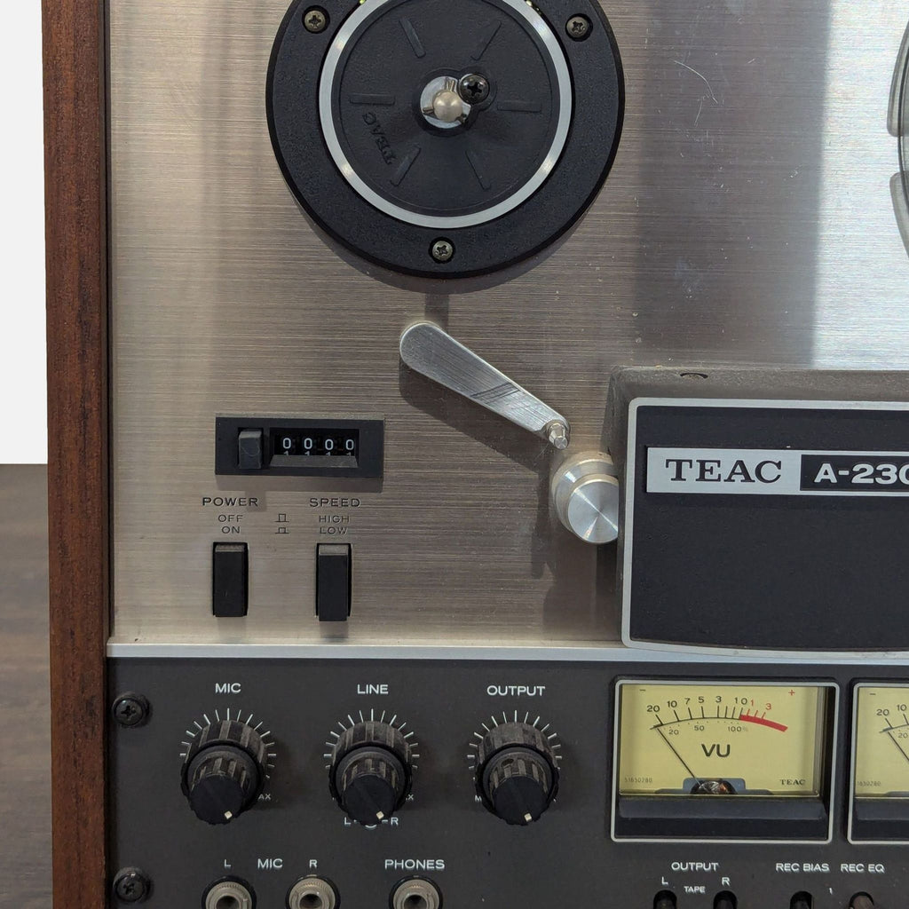 2. Compact TEAC audio component featuring display screen and various buttons, designed for home audio setups.