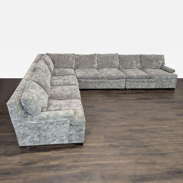 L-shaped sectional sofa by Lee Industries with soft fabric, deep cushions, and wide armrests in a neutral tone.  