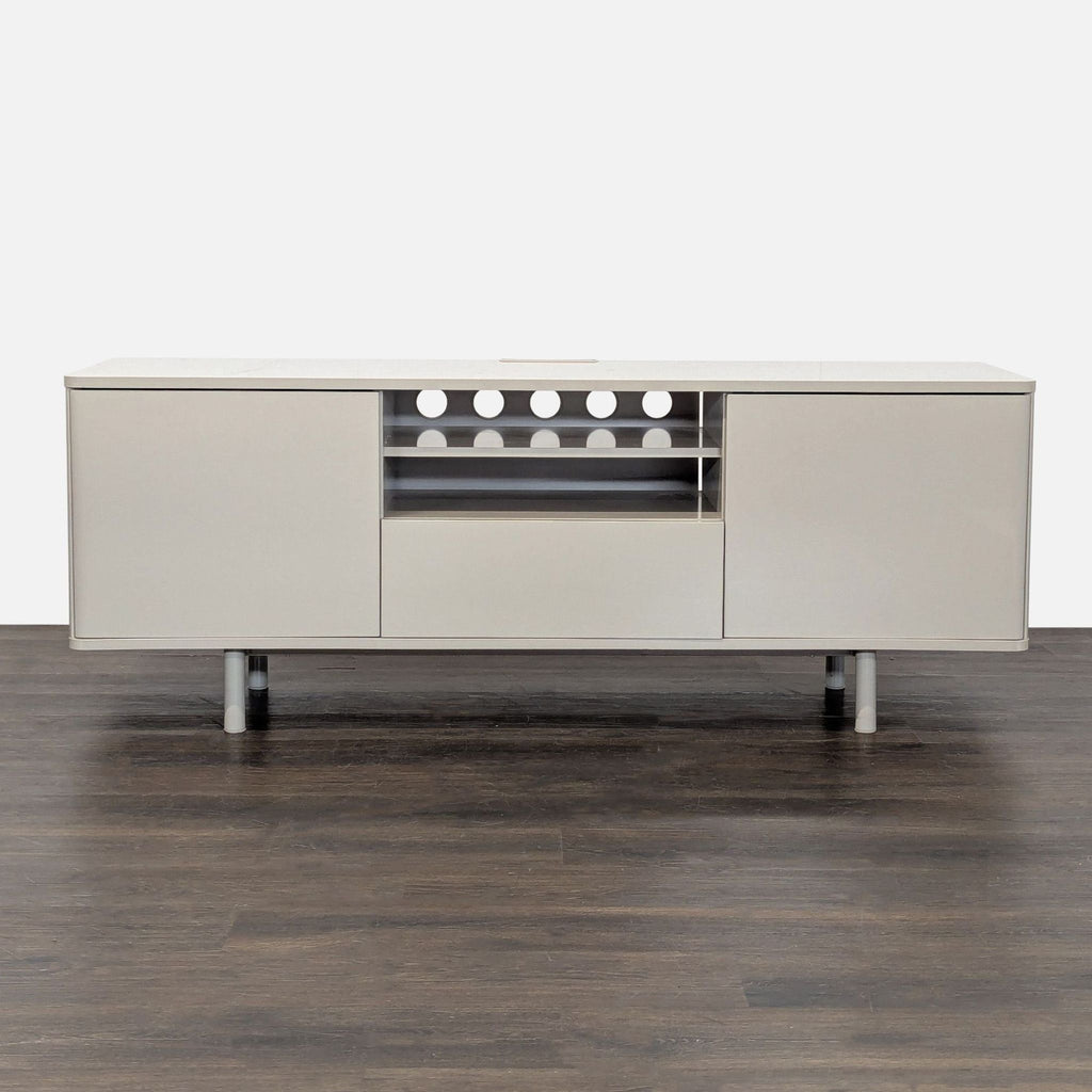 Modern Ikea media console with two side cabinets, central shelf, and large drawer in a neutral finish.