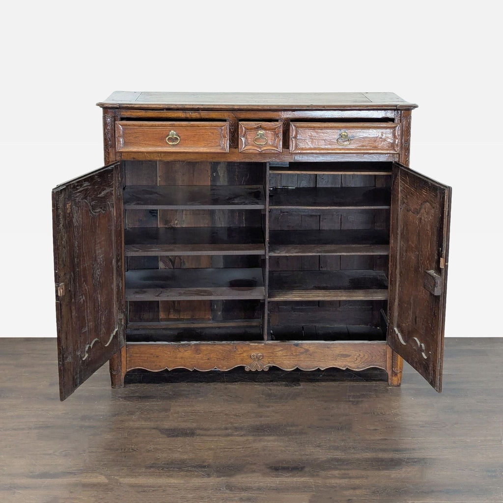 Classic sideboard credenza featuring ornate woodwork, rich finish, and practical storage with multiple compartments.