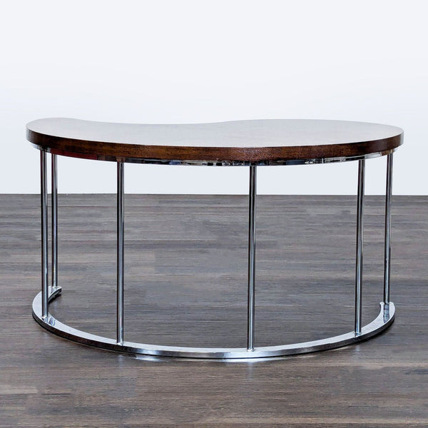 Chevron wood pattern coffee table with chrome base, viewed from above.