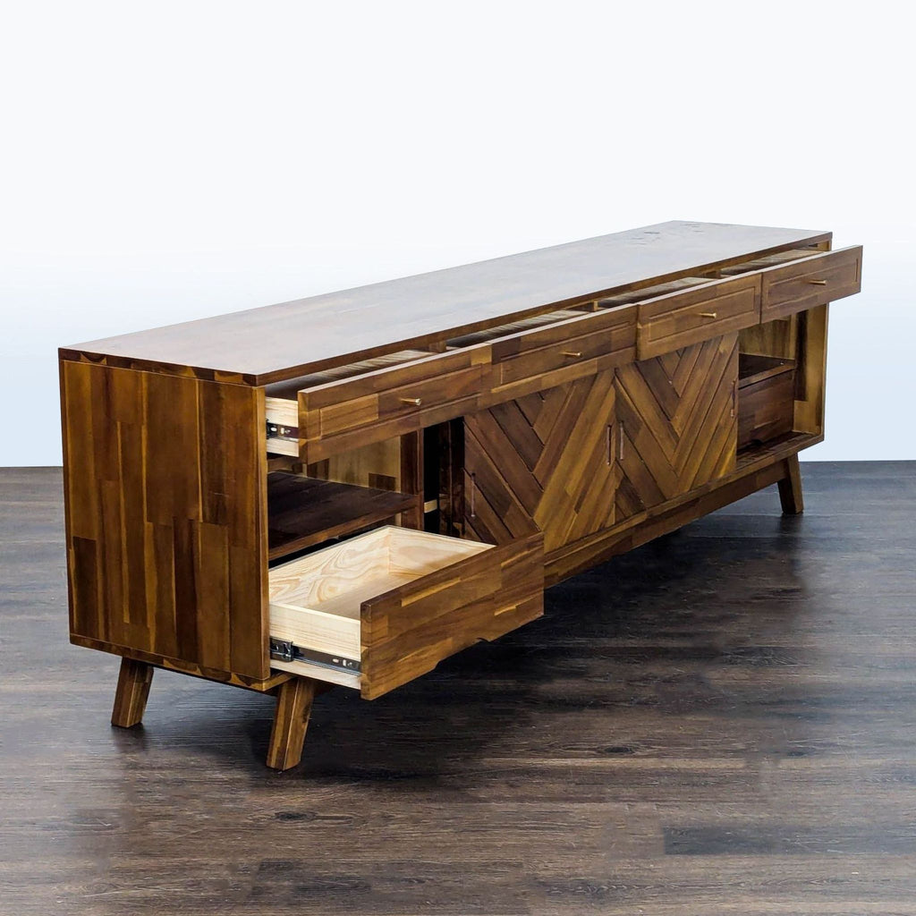 Modern walnut entertainment console featuring chevron detailing, four drawers, and spacious lower cabinets.