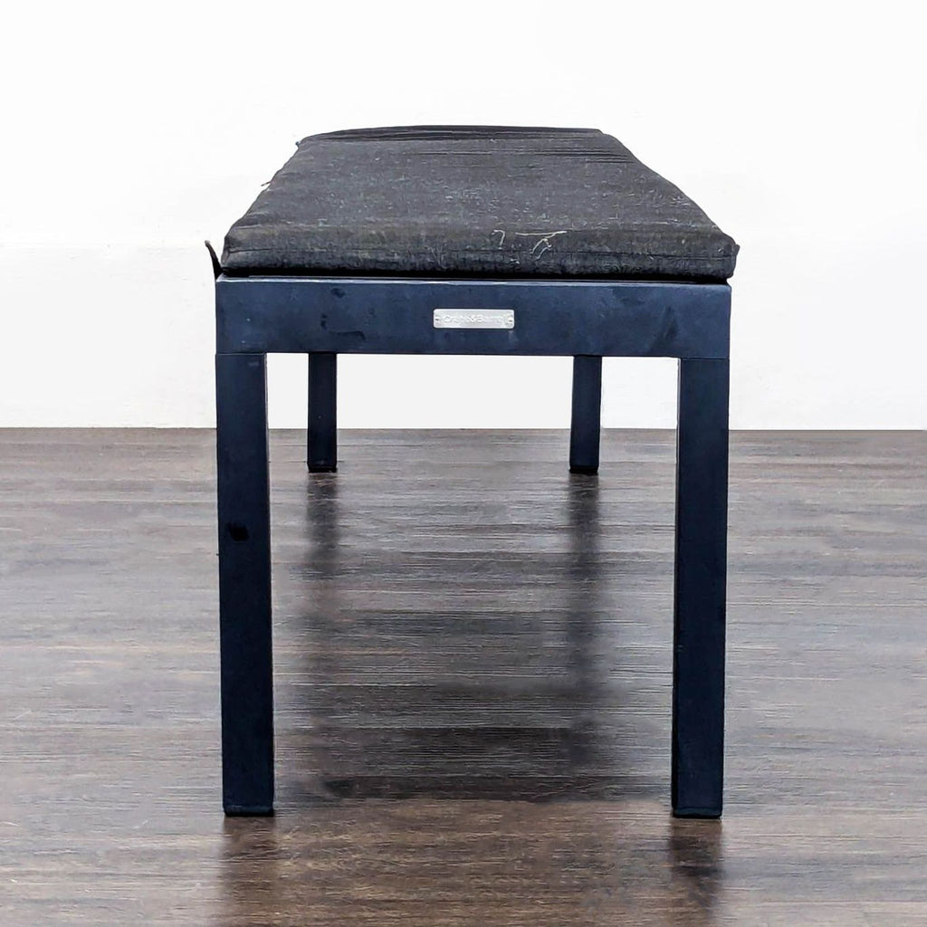 2. Sleek Crate & Barrel bench with neutral fabric and sturdy frame, perfect for hallway seating.  