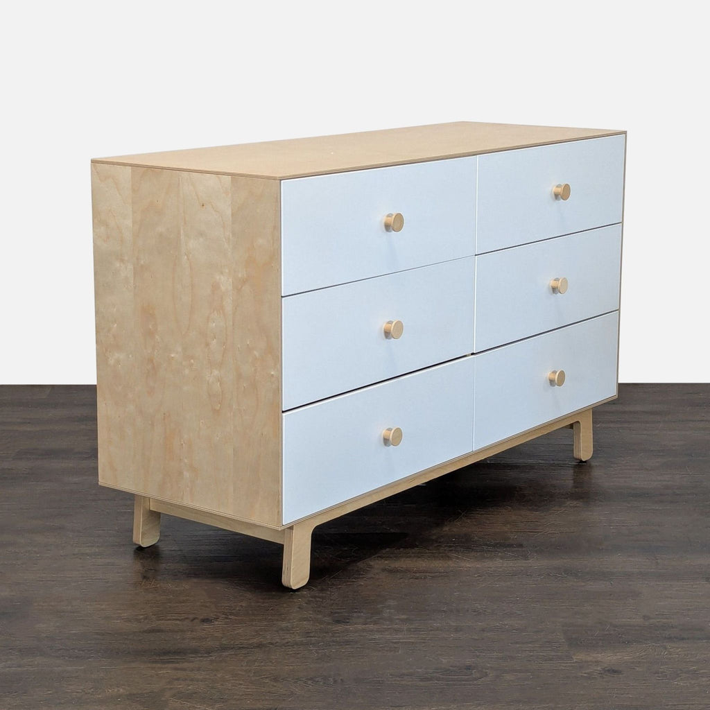 Contemporary birch and white dresser by Oeuf, featuring ample storage space and a clean, minimalist design.