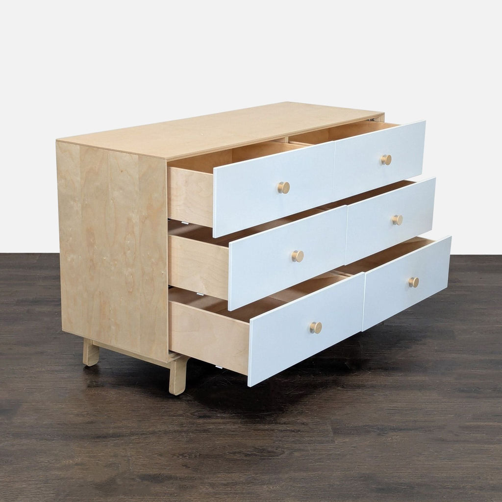 Six-drawer Oeuf dresser in birch and white, perfect for organizing clothes in bedrooms or nurseries.  