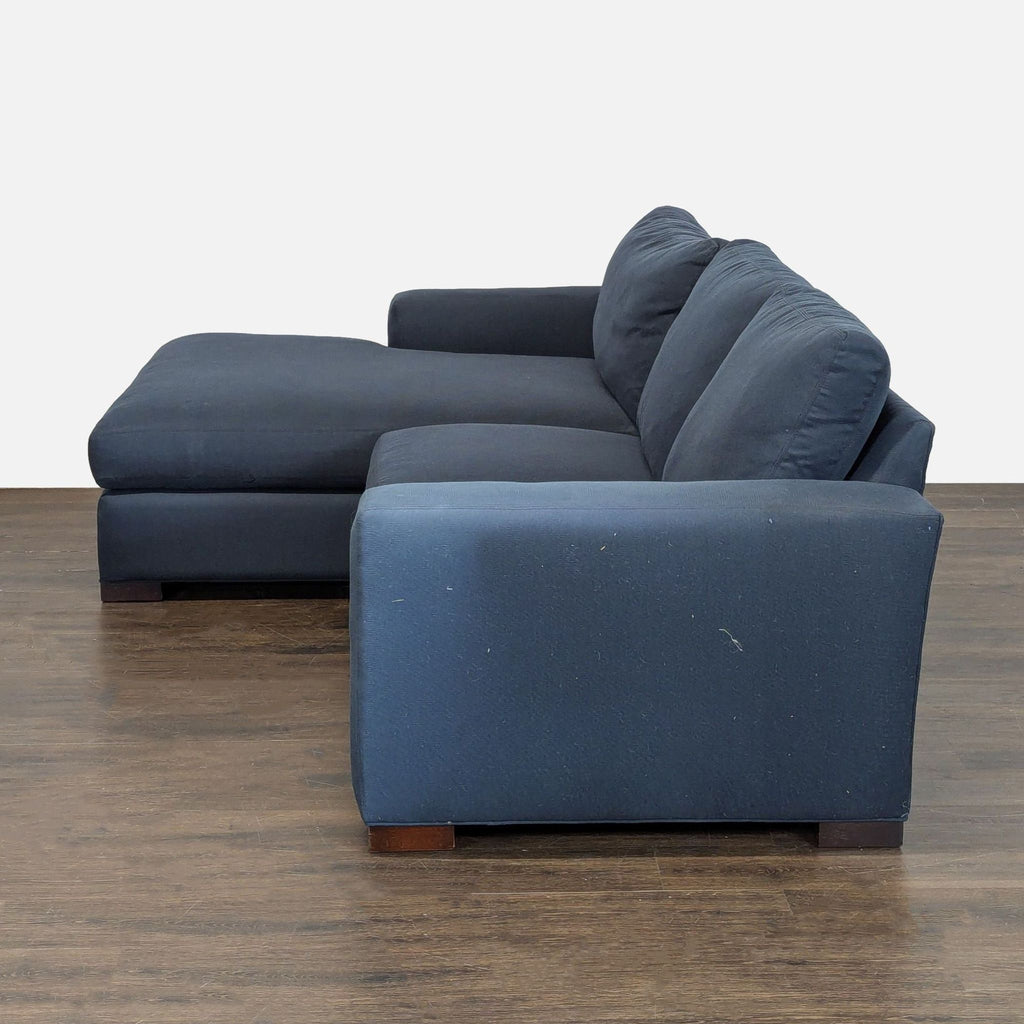 Room and Board chaise sectional in deep blue upholstery, combining stylish comfort and durable construction.