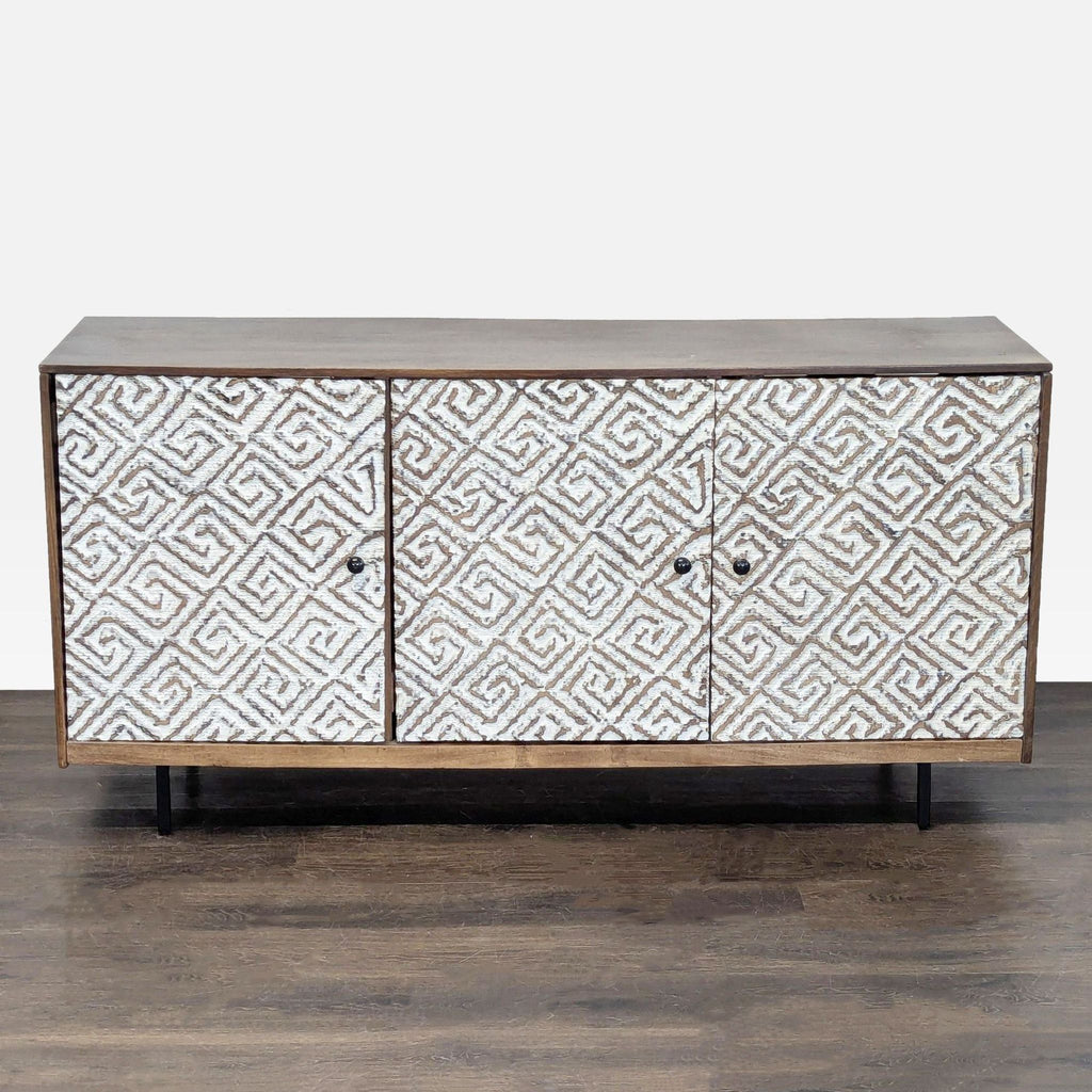 Flush-mount doors with carved Greek key design entertainment center from Ashley Furniture; wood finish and ample storage.