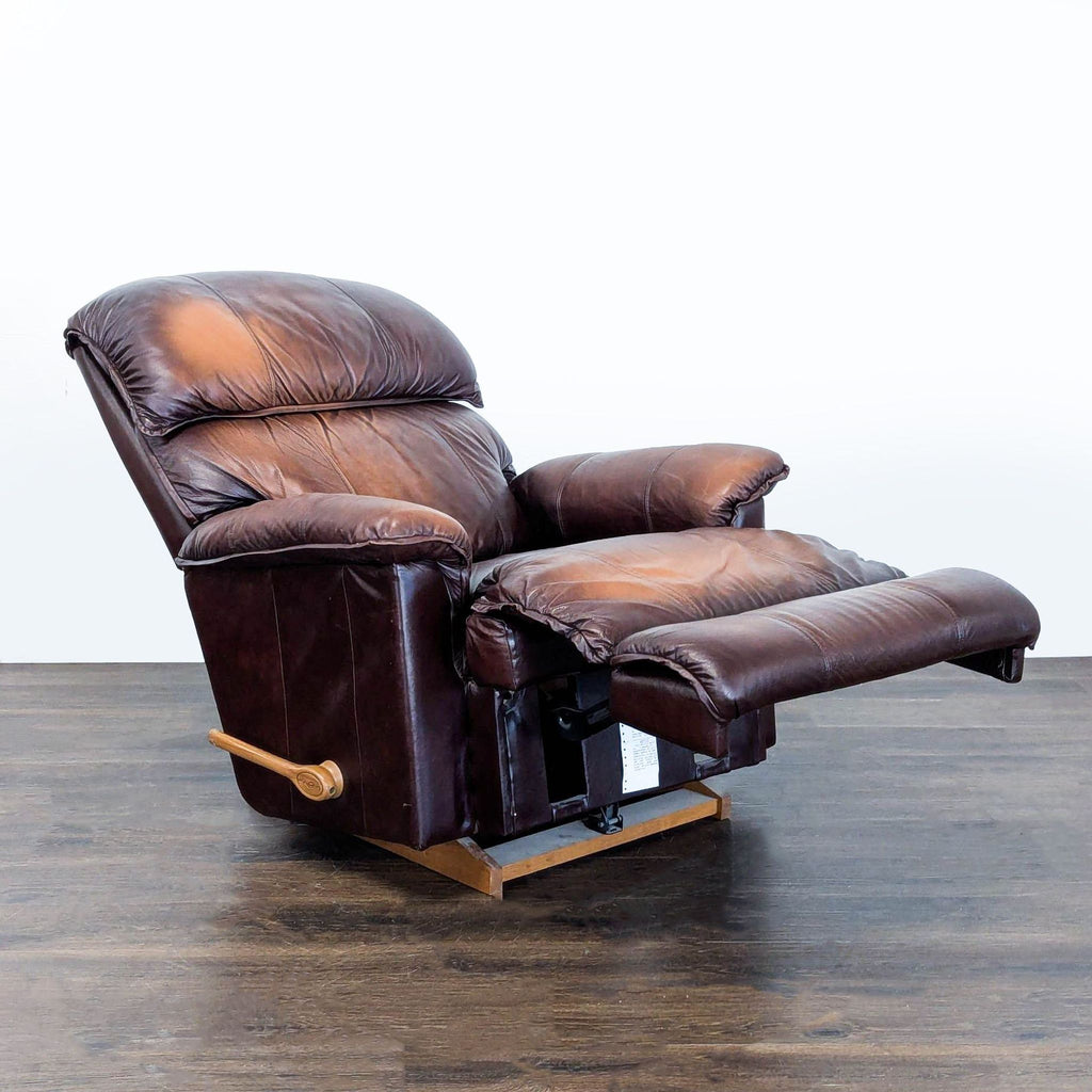 3. La-Z-Boy lounge recliner shown in a fully reclined position with extended footrest and brown leather finish.