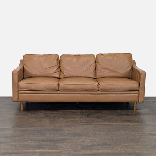Modern tan leather 3-seat sofa with deep cushions and straight arms, ideal for contemporary living rooms.