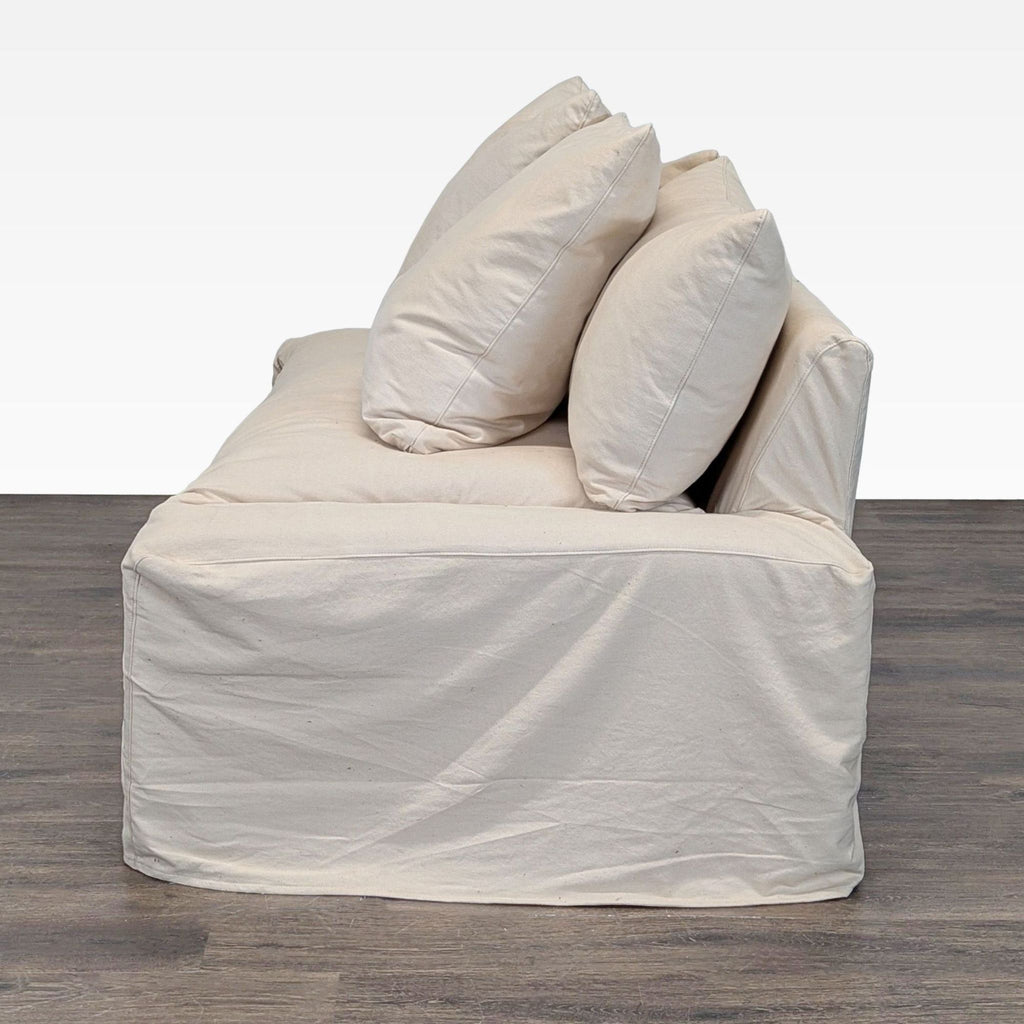 1. Modern Crate & Barrel loveseat with plush cushions and sleek lines, perfect for small spaces.