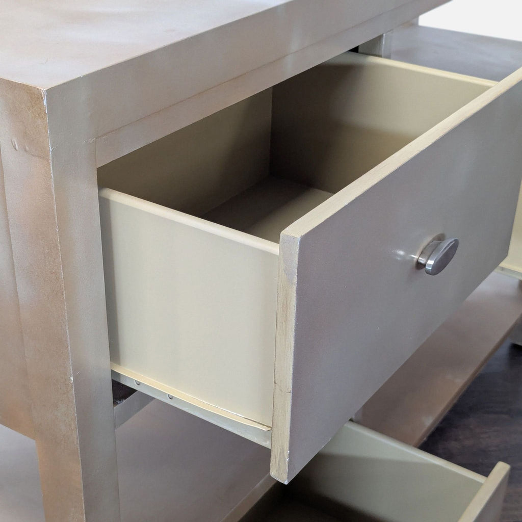 Contemporary media unit with wood finish, offering storage in three drawers and multiple open shelves.