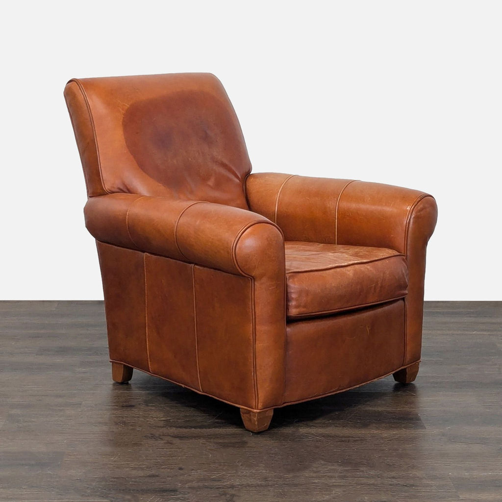 2. Angled view of an Ethan Allen brown leather lounge chair, showing its rolled arms and supportive, plush seat.  