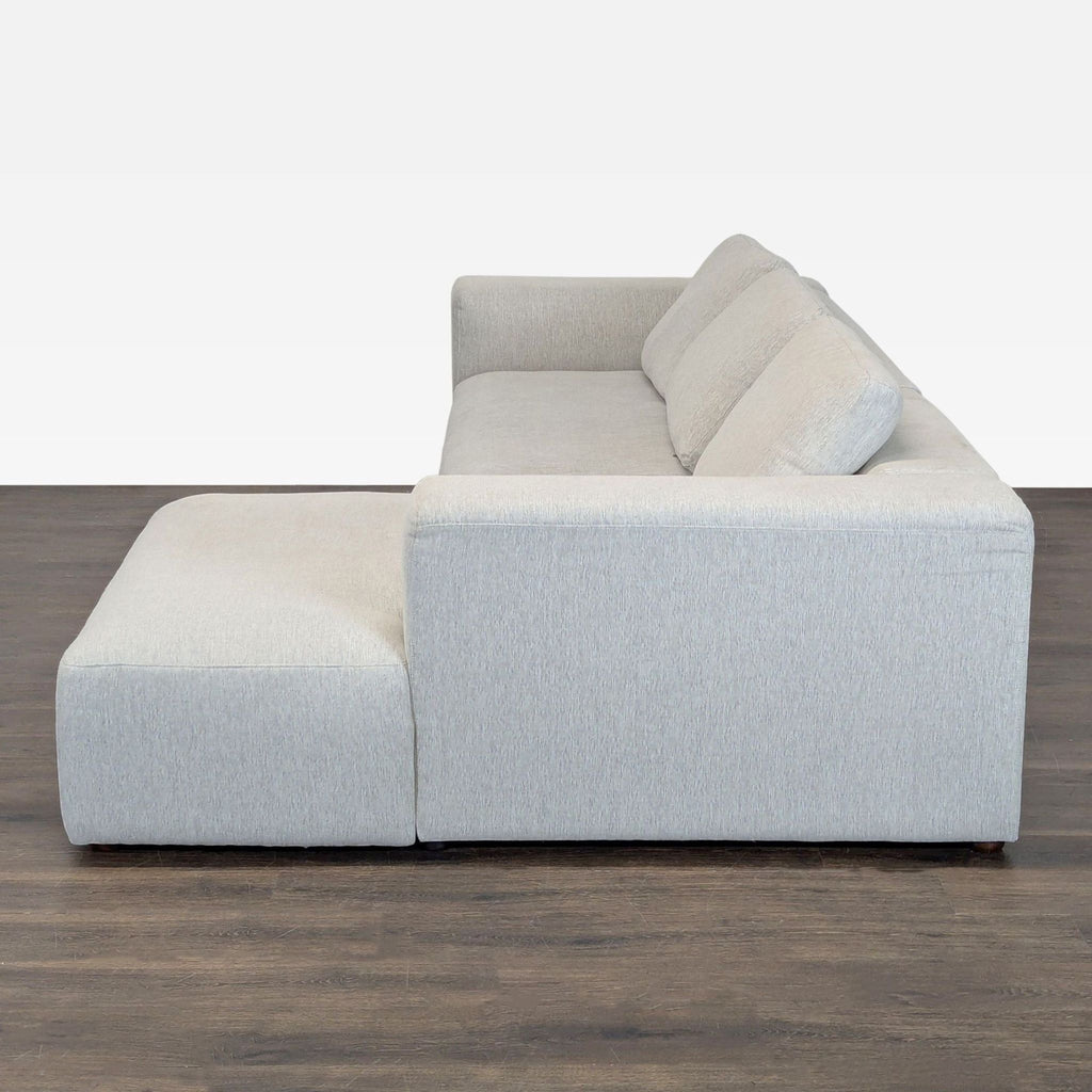 Contemporary sectional by Foundry Furniture, ideal for family rooms, with a comfortable chaise and wide armrests.