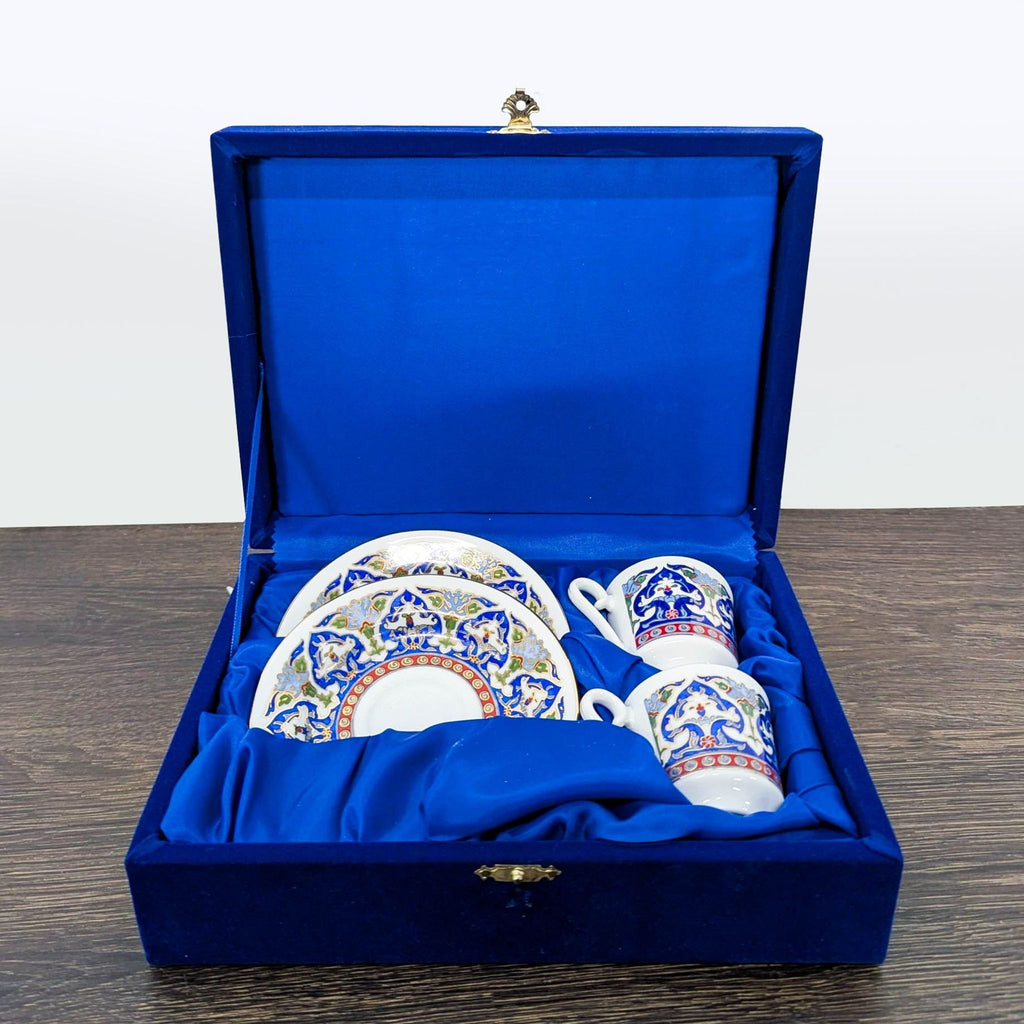 Kütahya Porselen coffee cup and saucer set with blue and gold design, displayed in a blue velvet gift box.