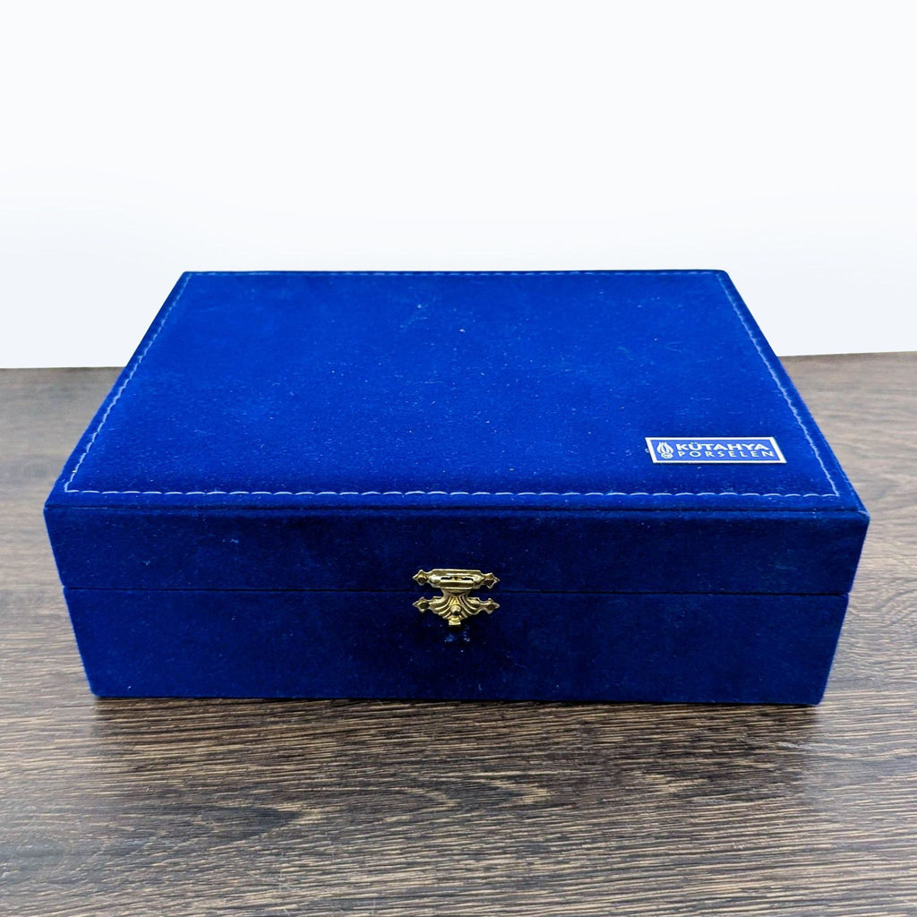 Elegant blue and gold patterned coffee cup and saucer set from Kütahya Porselen, presented in a velvet case.