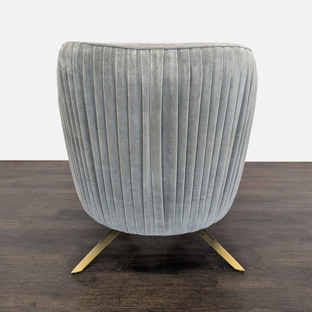 Gray velvet West Elm lounge chair, ribbed side design, gold base, perfect for stylish relaxation.