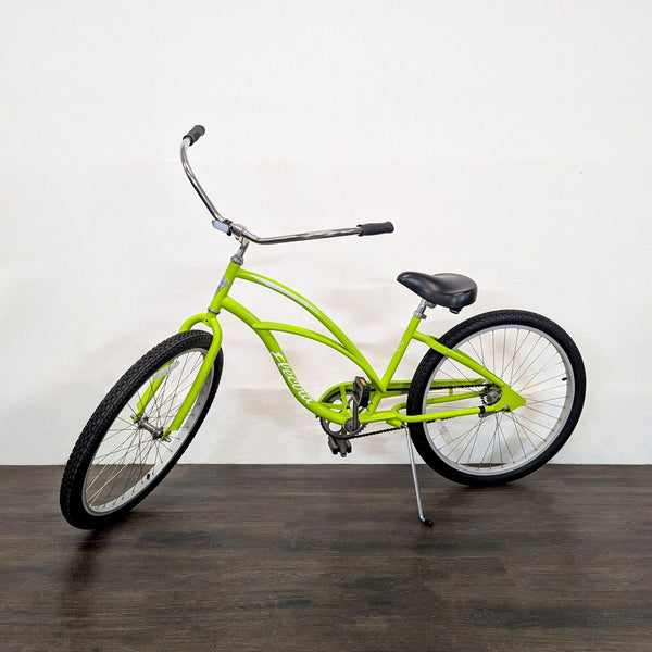 Bright green Electra Cruiser 1 bike with wide handlebars and padded seat, ideal for casual outdoor cycling.