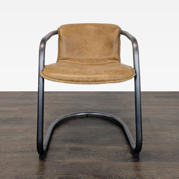 Brown leather lounge chair with a black metal curved frame, blending comfort with modern, industrial style.