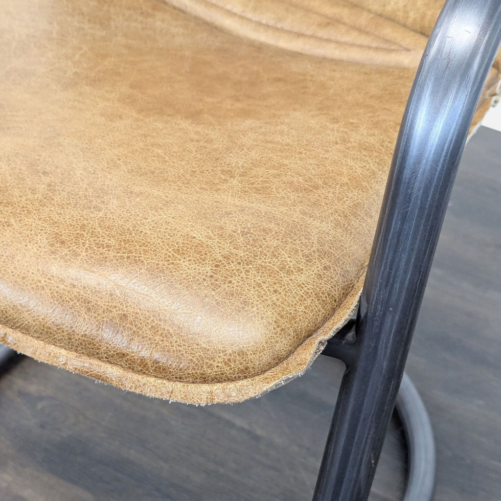Industrial Style Lounge Chair with Metal Frame and Brown Leather Seat