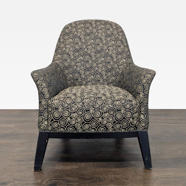 Lounge chair with black and tan swirl upholstery, dark wood legs, and a supportive back.