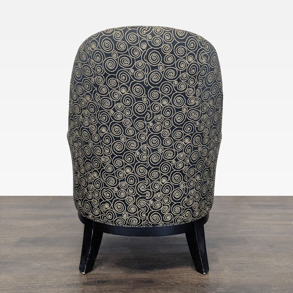 Stylish lounge chair showing swirling black and tan upholstery and dark wood legs, ideal for relaxing.
