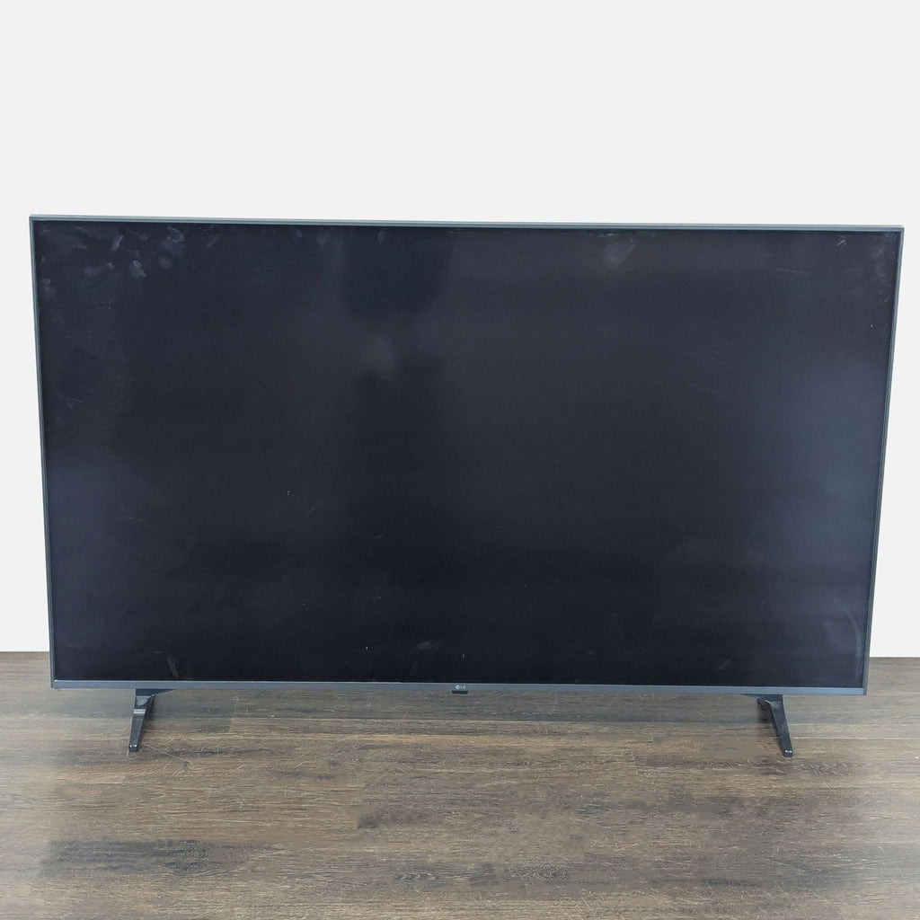 Large LG TV with vibrant display, sleek design, and no visible damage, ideal for living rooms or bedrooms.  