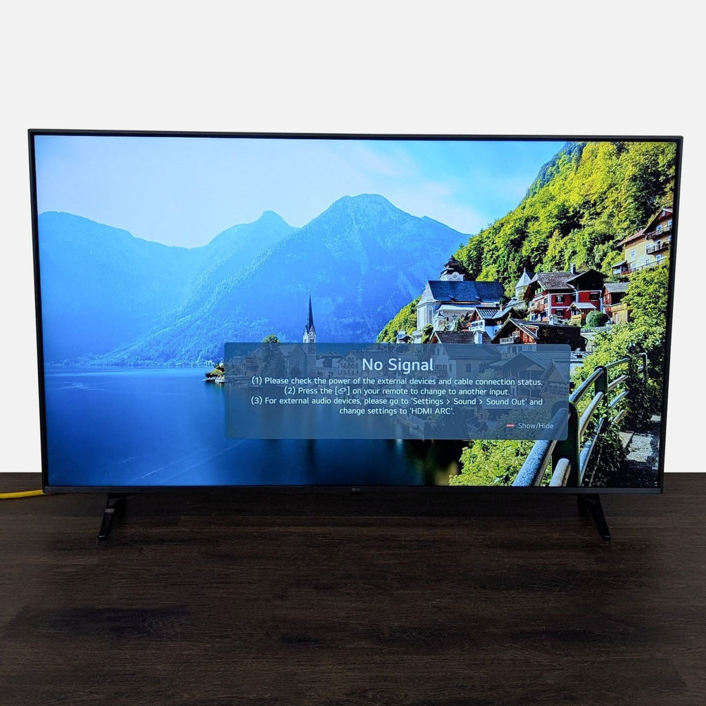 LG 50-inch LED TV with slim frame on stand, showing clear Full HD screen, remote and cables not included.  