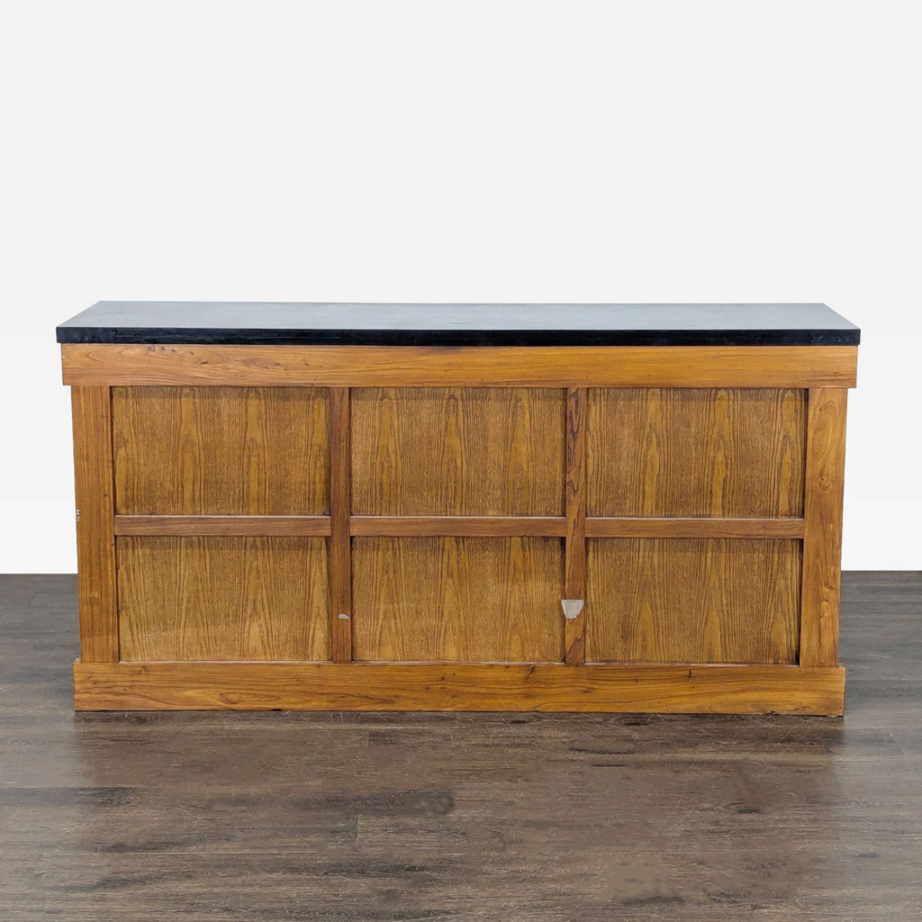 Vintage sideboard with traditional tansu joinery, zelkova wood grain, decorative ironwork, and a black granite surface.