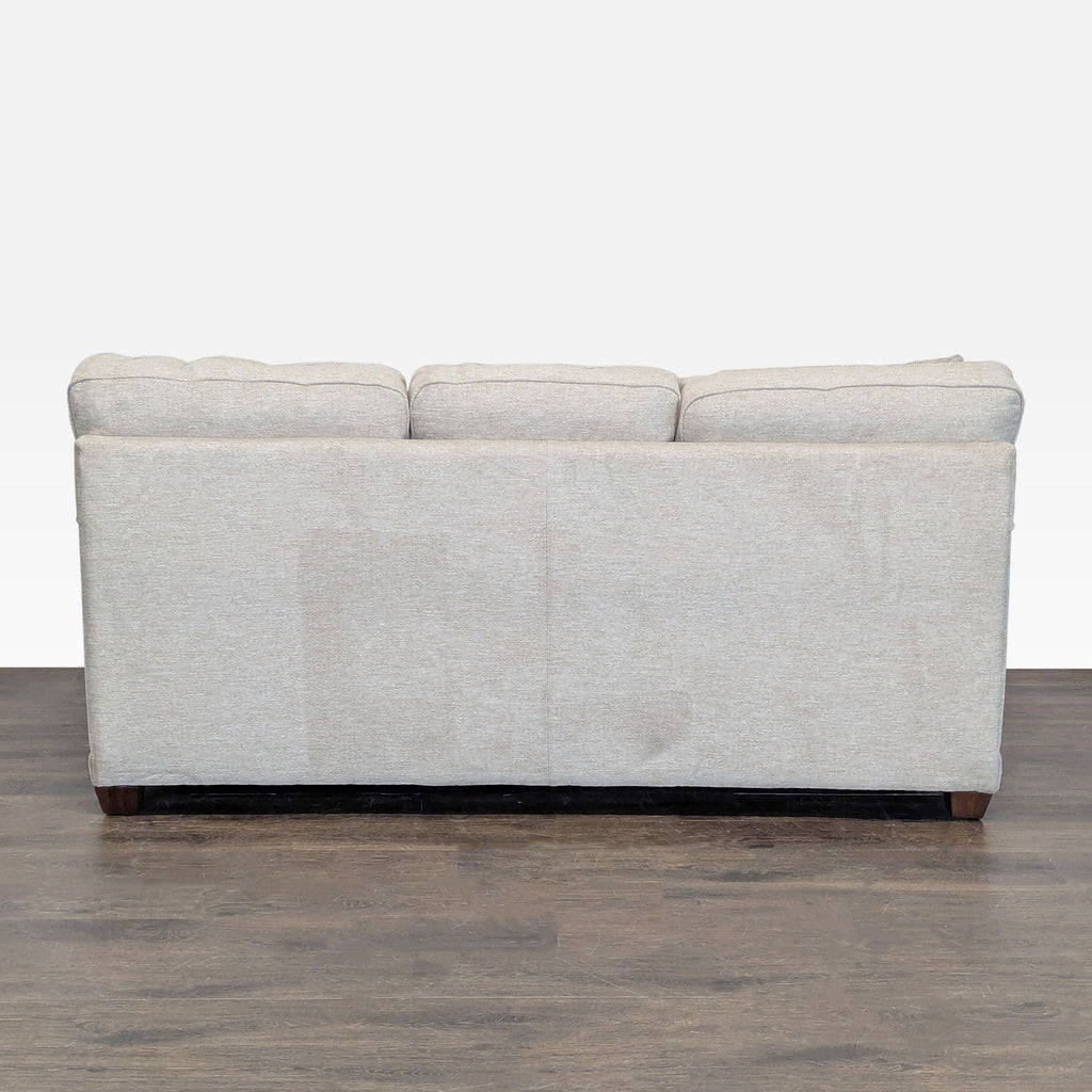 2. Contemporary La-Z-Boy brand 3-seater couch featuring sleek lines and comfortable padded seats.  