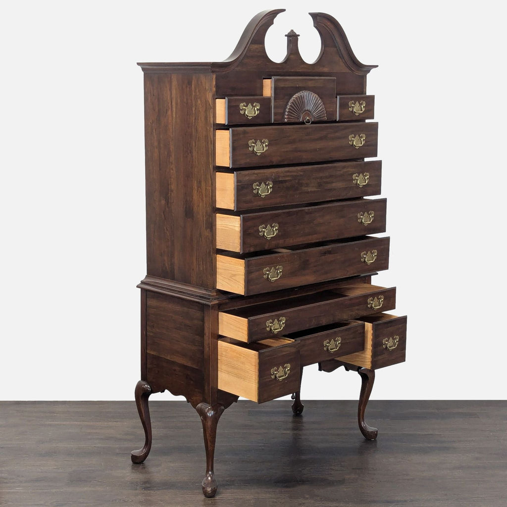 Classic solid wood highboy dresser featuring elegant brass handles, decorative shell carving, and spacious drawers.