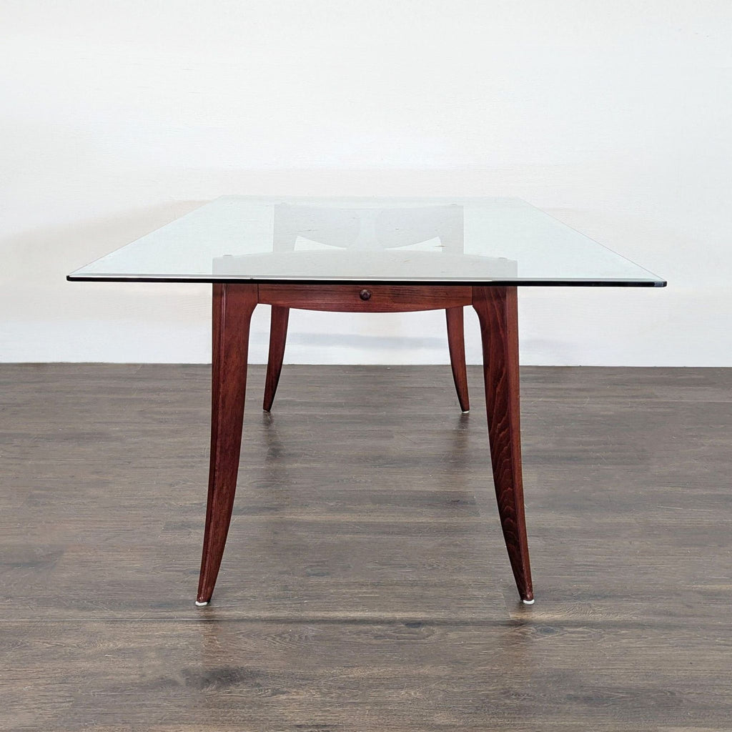 2. Contemporary dining table by Z Gallerie featuring a clear beveled glass top and sturdy wood base.  