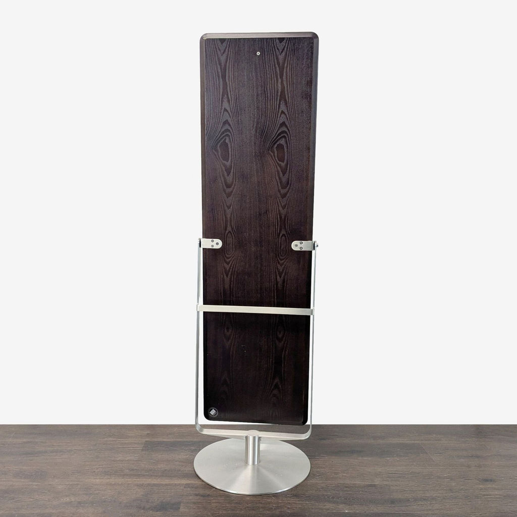 Contemporary BDI mirror featuring a tilting function, floating within a sturdy wooden frame for flexibility.