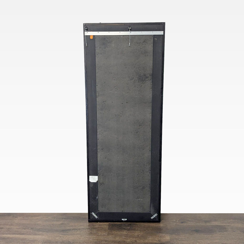 1. Modern Crate & Barrel wall mirror with a sleek, minimalist frame, ideal for contemporary home décor.
