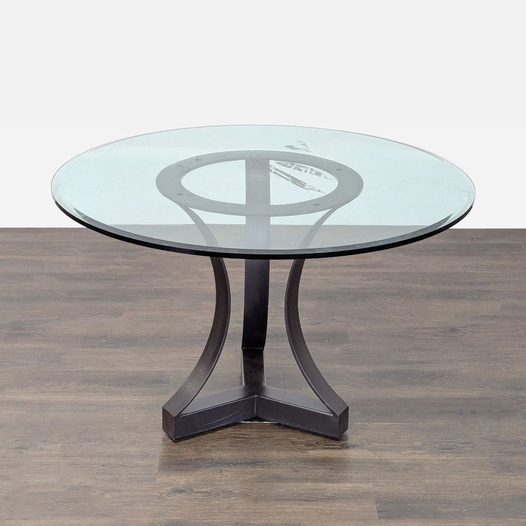 Round glass top dining table and four comfortable, burgundy cushioned chairs from Kreiss; perfect for any dining space.