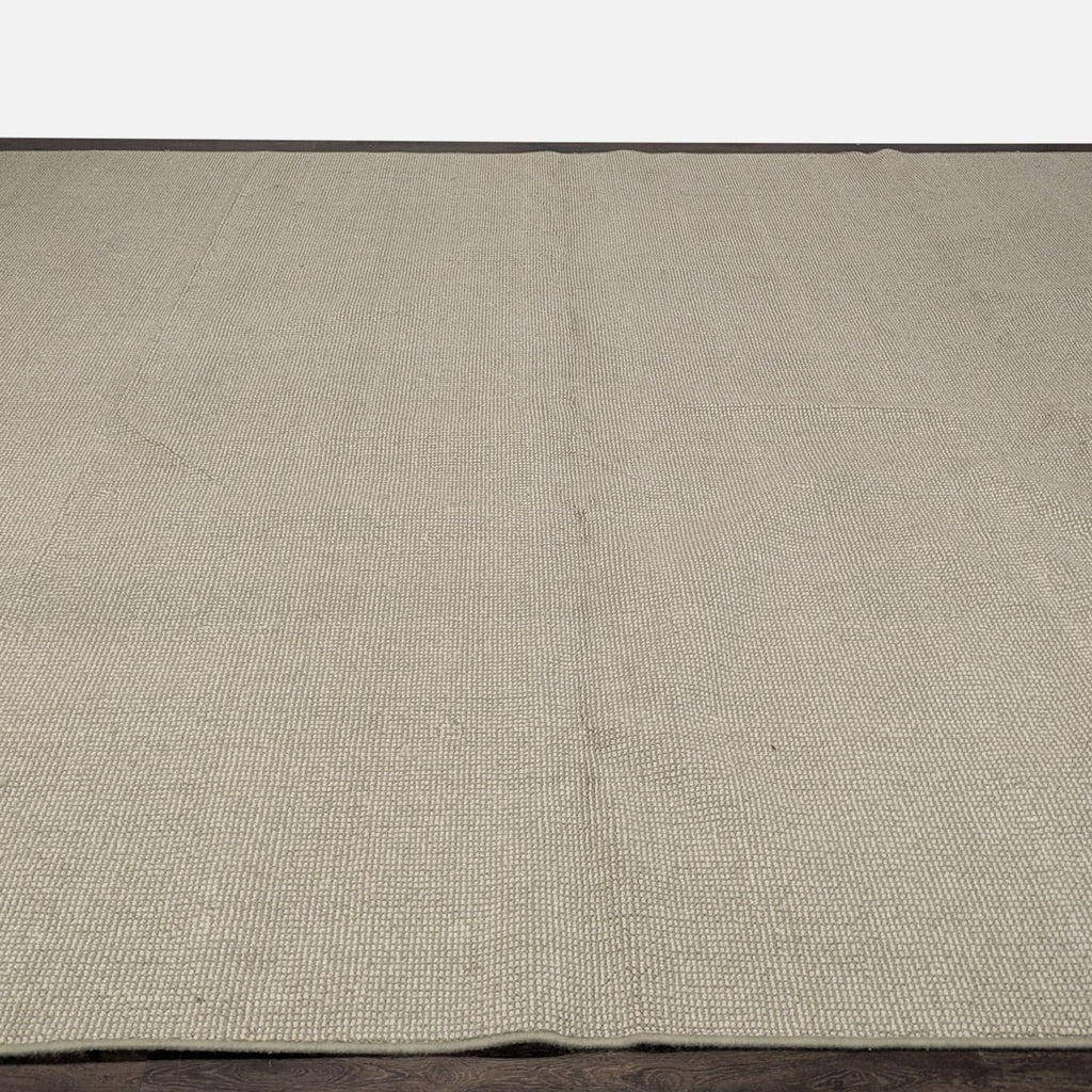 Neutral large rug with subtle woven texture, perfect for adding comfort and style to any room.