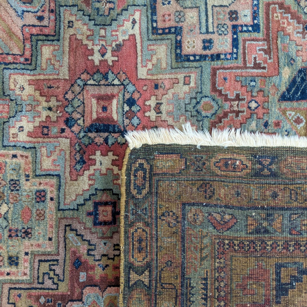 Worn vintage rug with bold geometric designs and subtle color fading, perfect as a unique room accent.