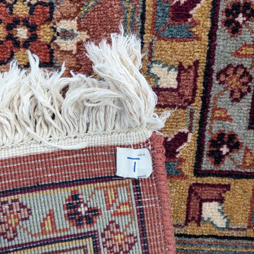 Traditional area rug featuring a bold medallion, detailed borders, and vibrant colors, suitable for various spaces.