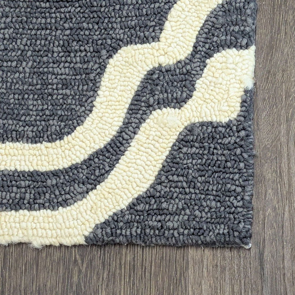 Modern Tommy Bahama rug in gray and cream, durable and elegant, perfect for bedrooms or offices.