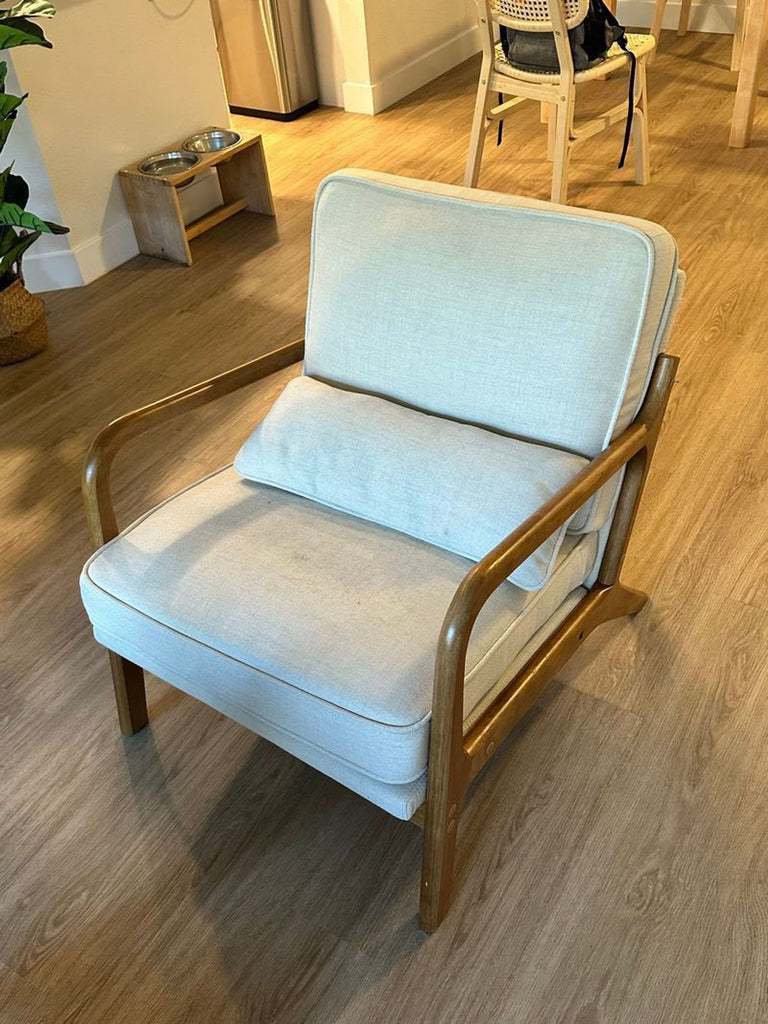 1. Mid-century modern lounge chair by George Oliver with wooden legs and upholstered seat.