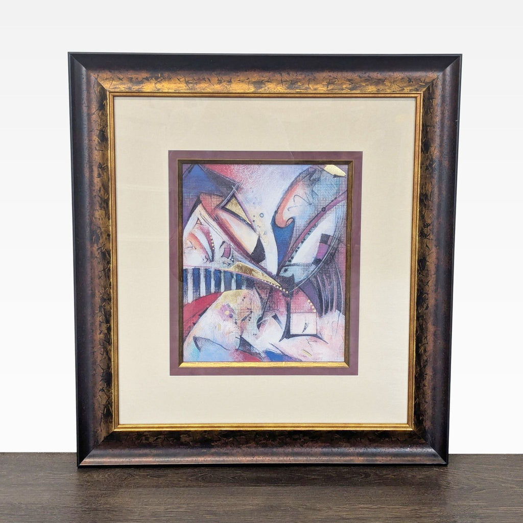 Abstract mixed-media artwork "Gravity" with blue, burgundy, blush, black, and gold in a dark wood gilt frame.