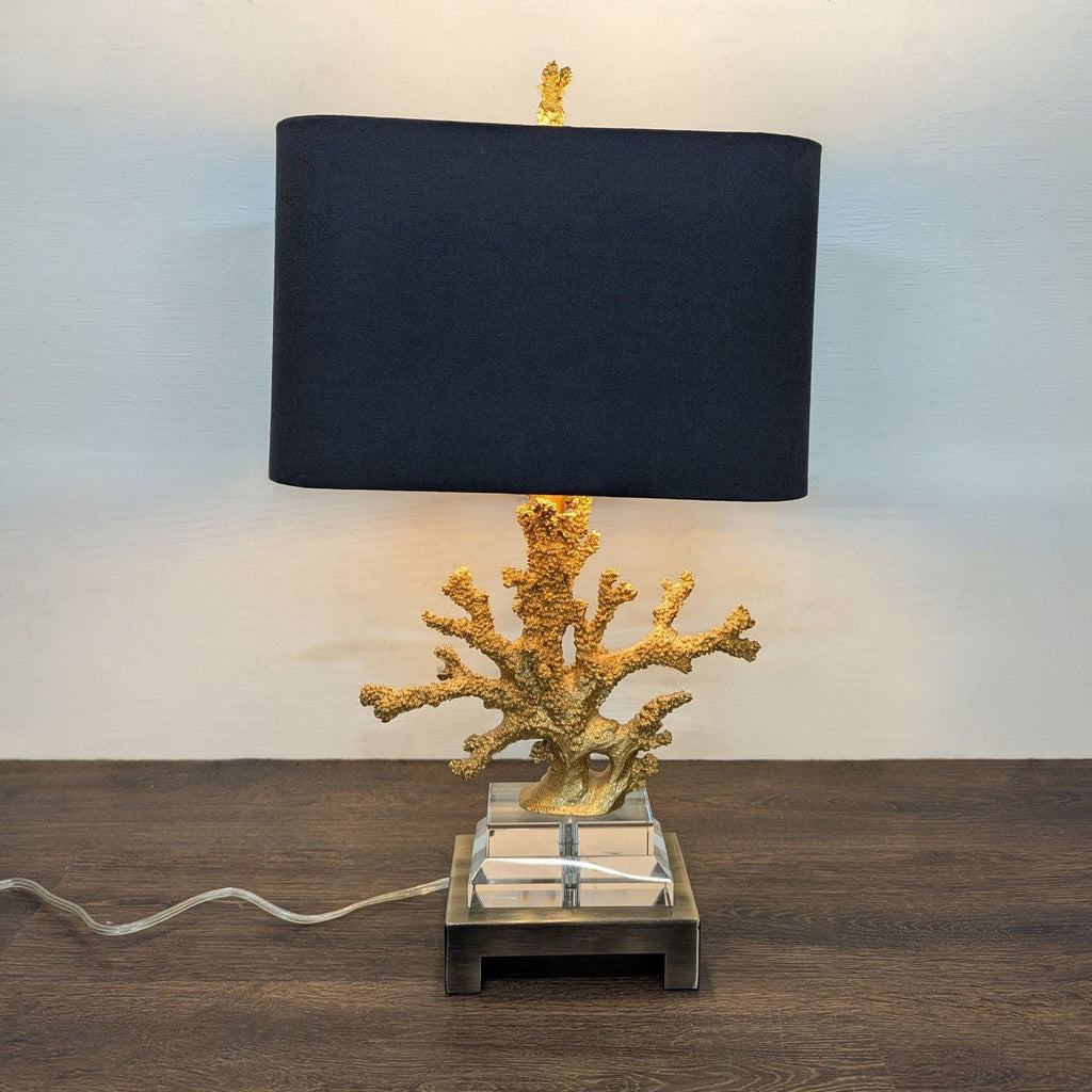 Gold faux coral table lamp with a textured base and black rectangular shade, ideal for modern spaces.  