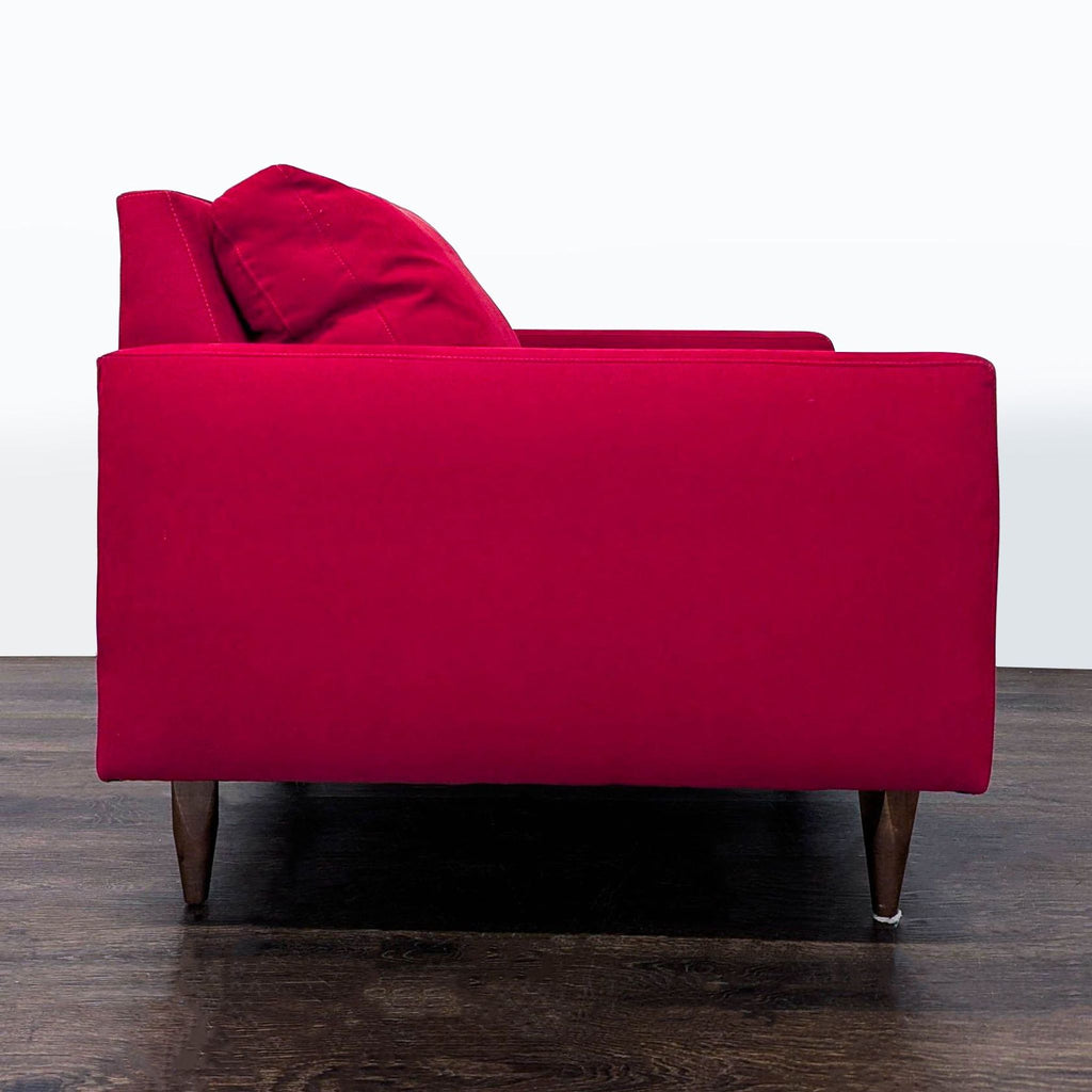 Stylish Lounge category chair by Room & Board, deep red fabric and comfortable for relaxing.