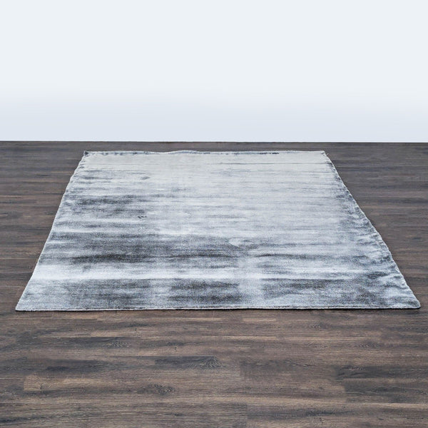 CB2 modern rug with soft grey ombre pattern, ideal for adding style and comfort to living spaces.