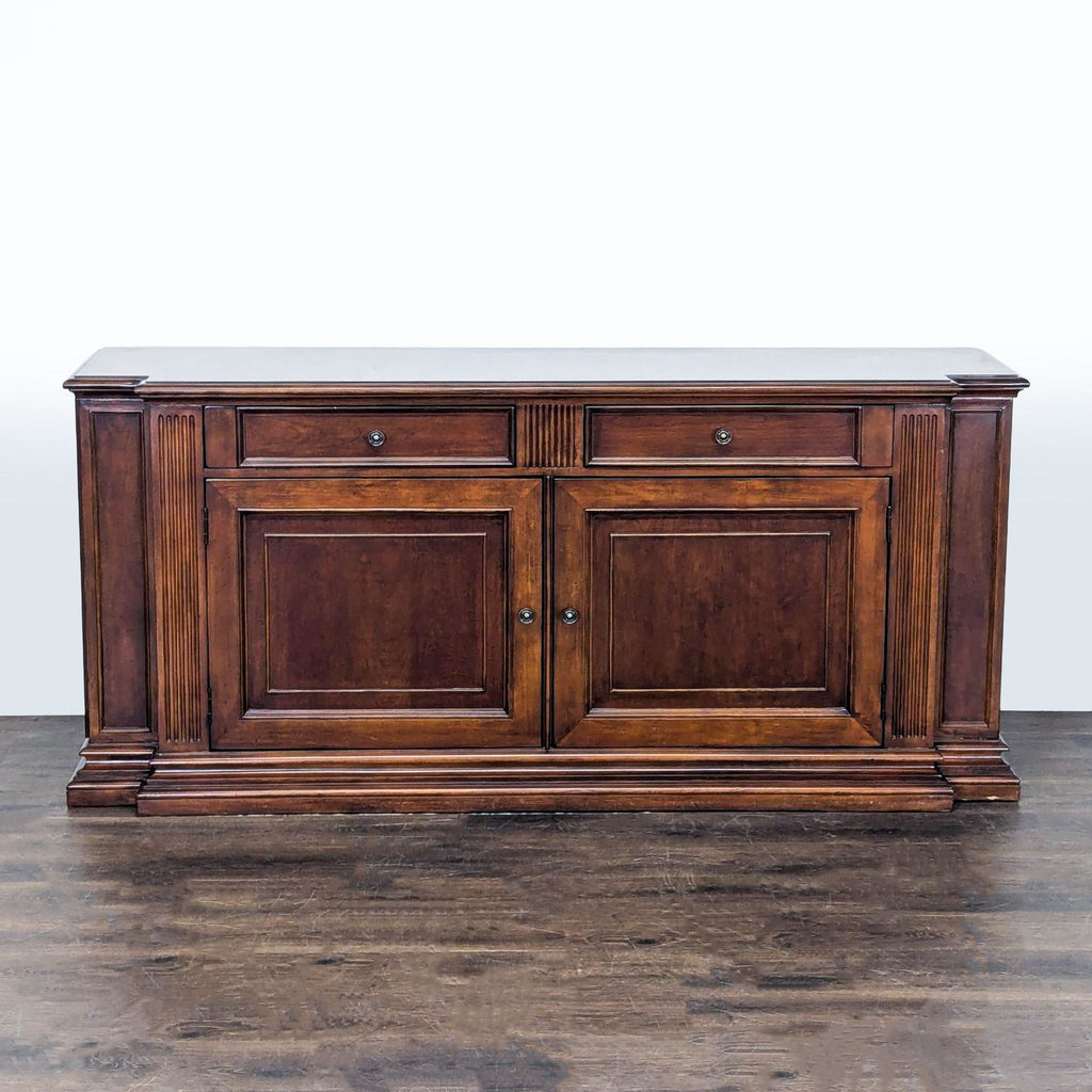 Ethan Allen sideboard and credenza with classic wood finish, two drawers, and double-door cabinets for storage.