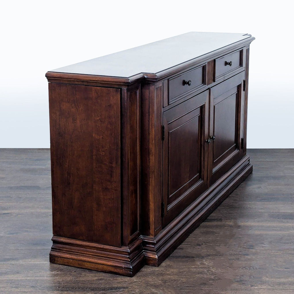 Ethan Allen credenza featuring wood design, dual drawers, side shelves, and cabinet space for versatile storage.